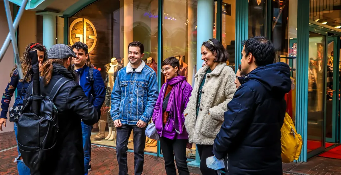 A group of tourists on a walking tour in Berlin, Germany.