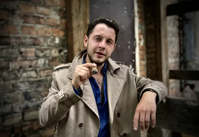 A tour guide in Warsaw, ready to lead an adult-themed walking tour.