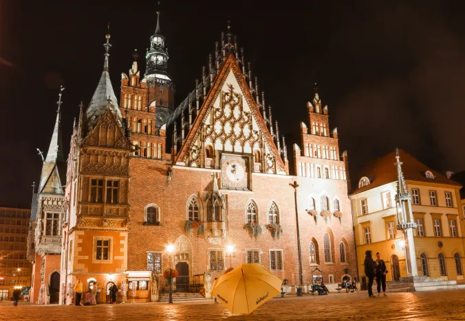 Night view of Wrocław's Old Town Hall, a stunning example of Gothic architecture.