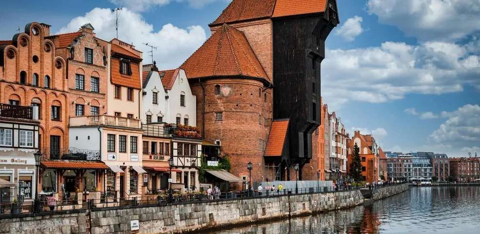 Explore Gdansk's historic waterfront, featuring the iconic Crane and colorful buildings.