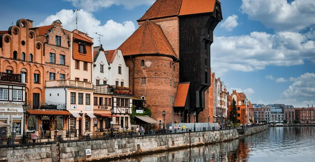 Explore Gdansk's historic waterfront, featuring the iconic Crane and colorful buildings.
