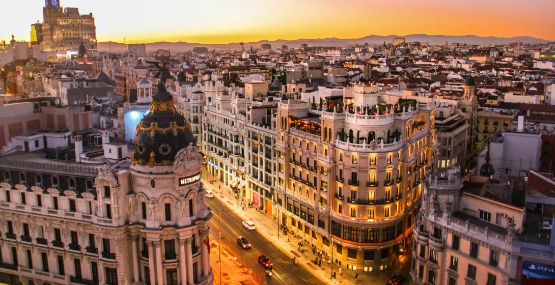 Sunset view of Madrid, showcasing the iconic Metropolis Building.