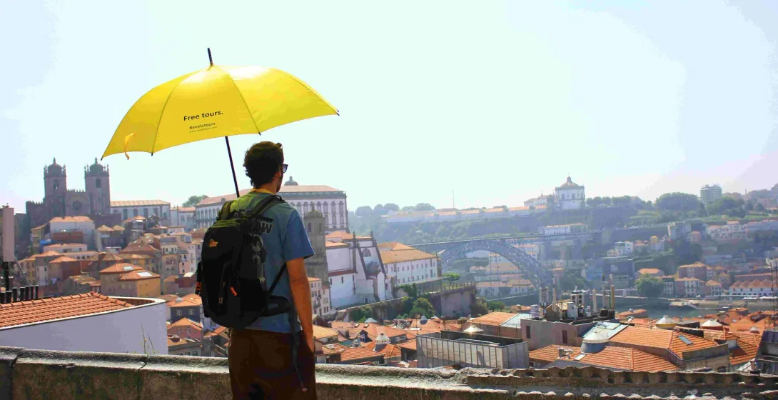 Tourist enjoying a free walking tour in Porto, Portugal.