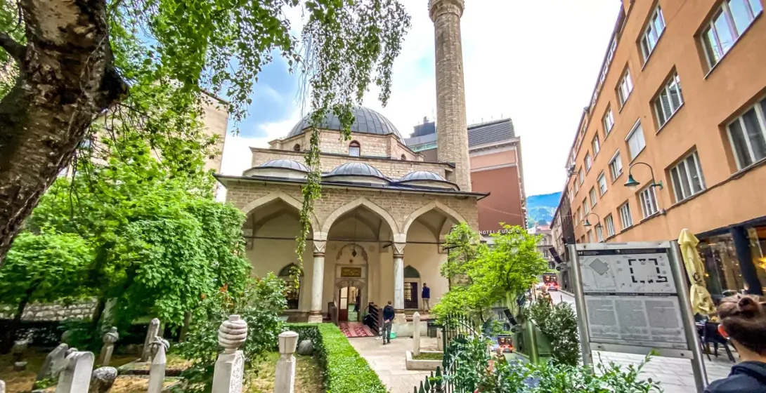 A tour group visits the historic Gazi Husrev-beg Mosque in Sarajevo.