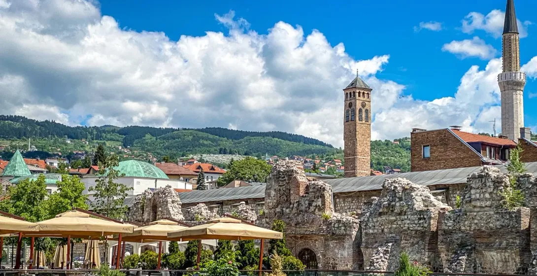 Sarajevo's Clock Tower and Roman ruins, a blend of history and modern life.