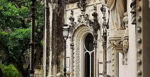 A rain-soaked walkway at Quinta da Regaleira Palace in Sintra, Portugal.