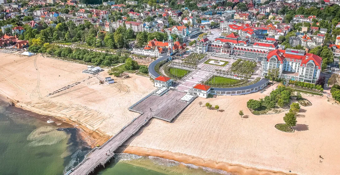 Aerial view of Sopot, Poland, showcasing its beautiful beach, pier, and cityscape.