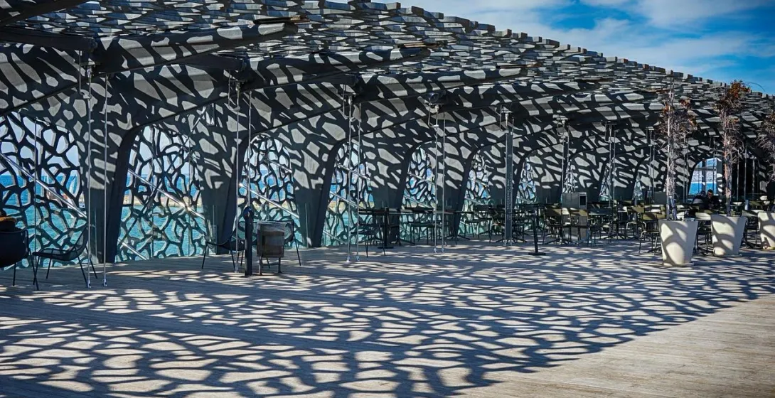 MuCEM terrace in Marseille with latticework shadows.