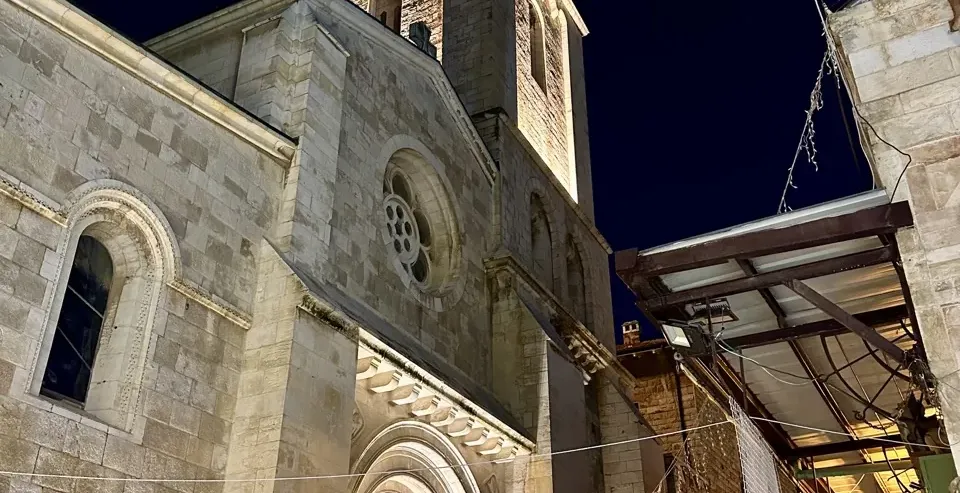 Illuminated Church of St. Anne at night in Jerusalem's Old City.