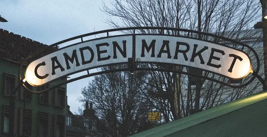 Tourists gather near the iconic Camden Market arch in London.