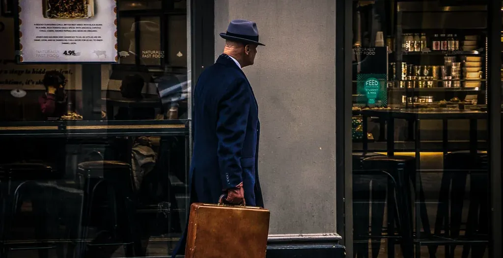 A man walks past a cafe in London.
