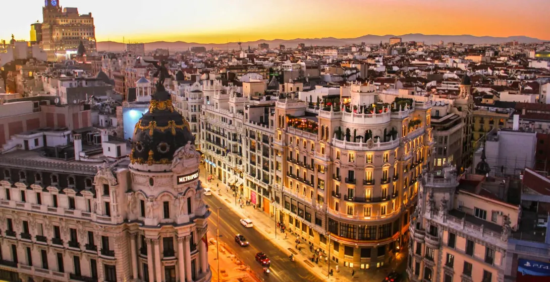 Stunning sunset view of Madrid's cityscape, showcasing iconic architecture.