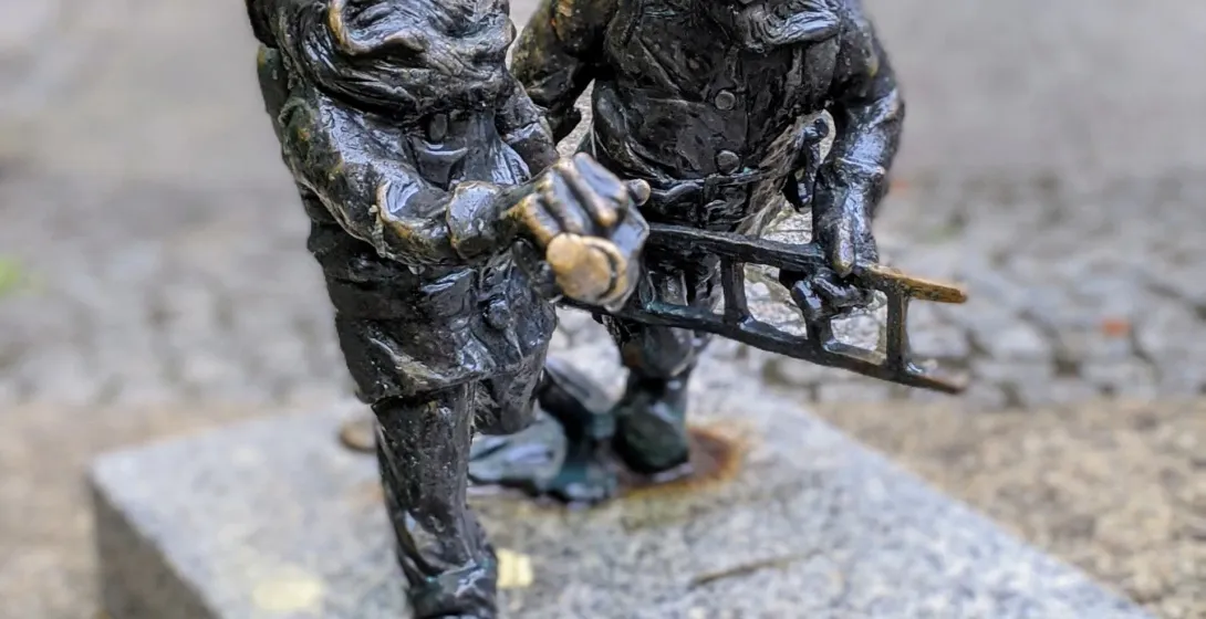 Two bronze firefighter dwarves in Wrocław, Poland.