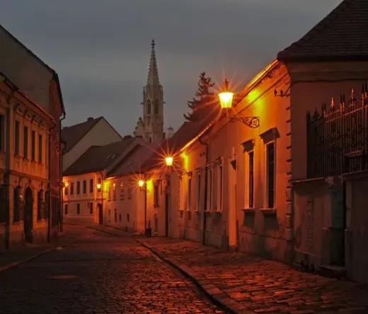 Spooky Bratislava tour: A charming cobblestone street at night.