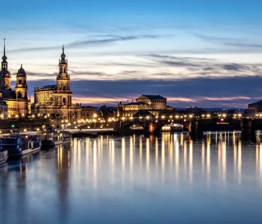 Dresden Old Town at night: Frauenkirche and Zwinger Palace illuminated.