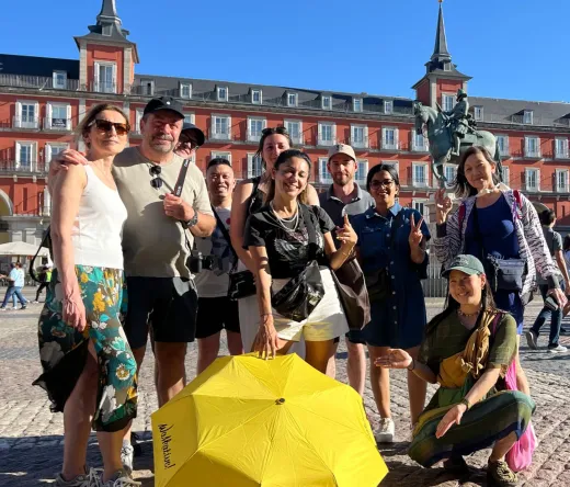 Happy tourists on a WALKATIVE! tour in Madrid's Plaza Mayor.