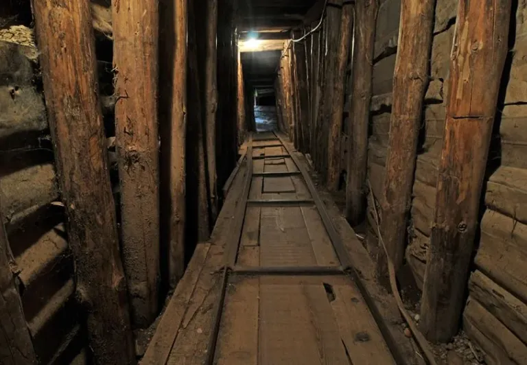 Interior of a dark, historical tunnel in Sarajevo.