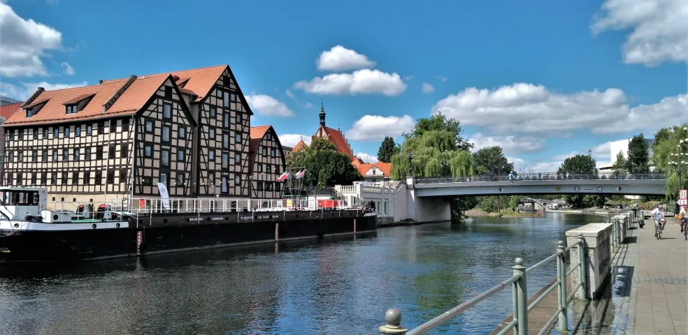 Bydgoszcz cityscape with river and architecture.