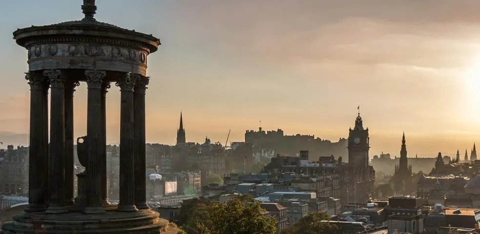Edinburgh cityscape with Dugald Stewart Monument at sunrise.