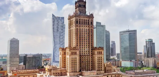 Panoramic view of Warsaw skyline with the Palace of Culture and Science and modern skyscrapers.