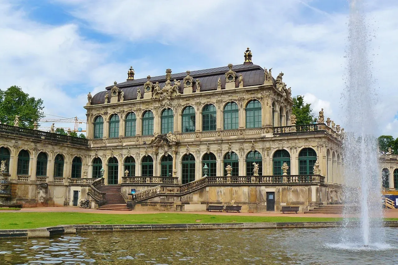 Zwinger Palace in Dresden, Germany: a stunning Baroque palace with a reflecting pool and fountain.