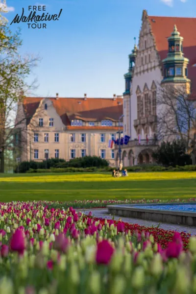Free Walkative! tour in Germany, showcasing beautiful tulips and historic buildings.