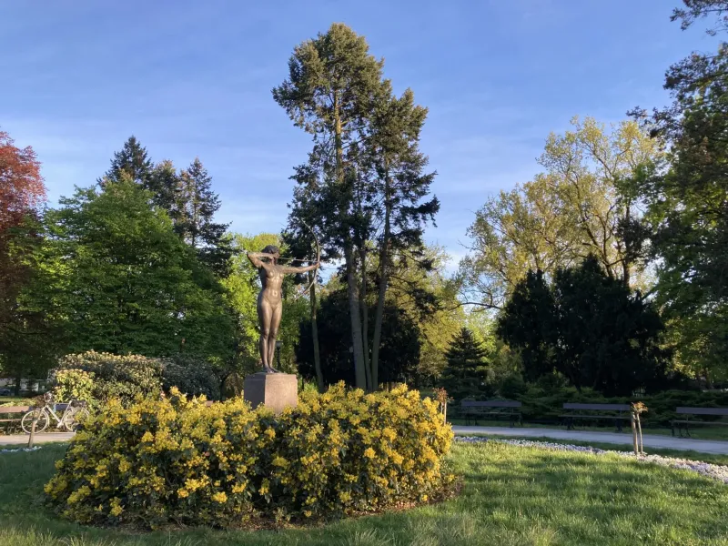 Bronze statue of an archeress in a Krakow park.