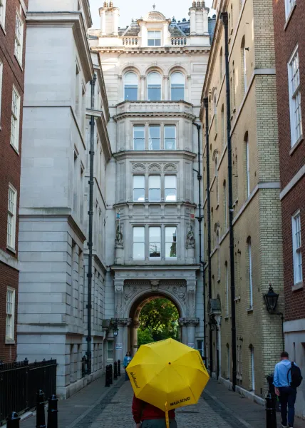 A guided walking tour in a charming London alleyway.