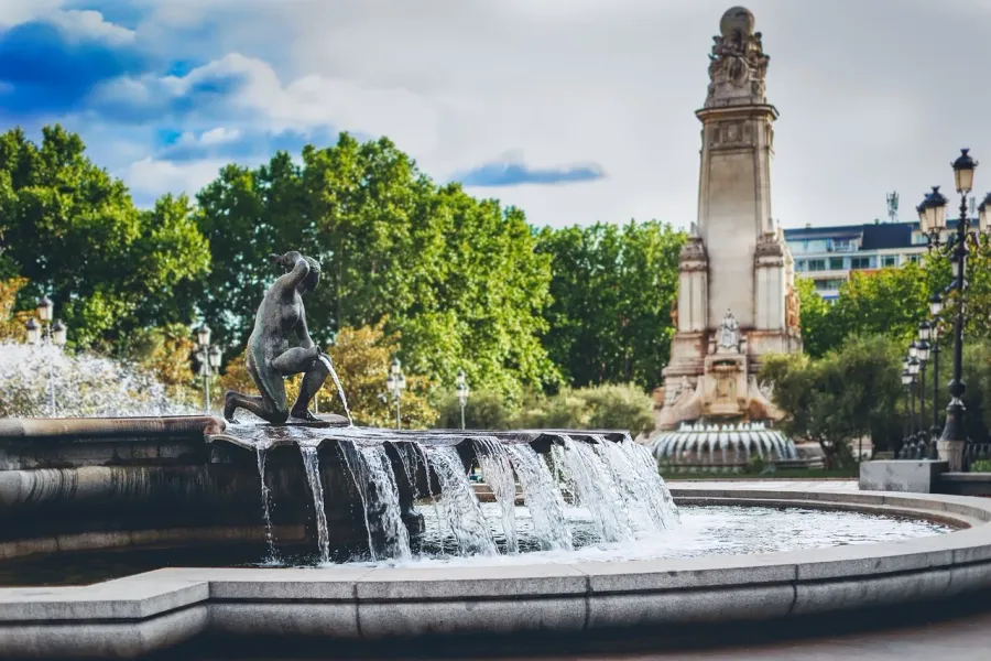 Serene fountain in Madrid with a captivating sculpture.