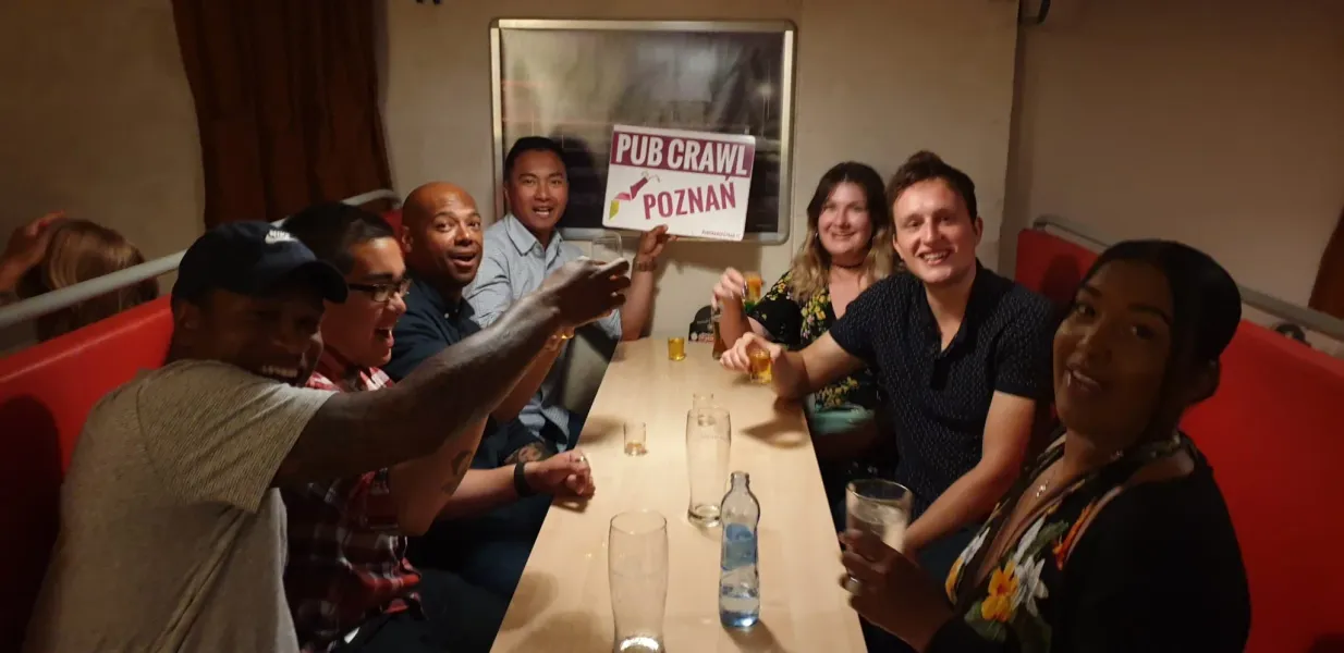 Happy tourists enjoying a Poznan Pub Crawl.
