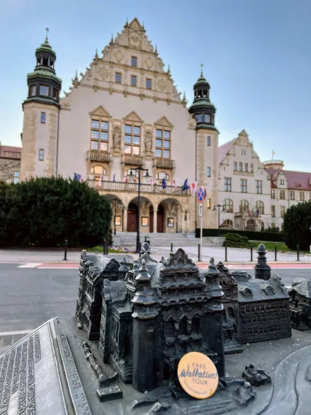 Bronze model of Wrocław's Old Town with the University in the background. Free Walkative! Tour badge.